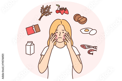 Unhappy girl with problems due to allergies and skin irritation or rash on face after eating