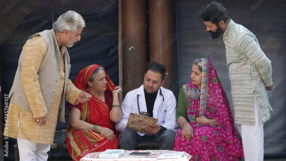 Doctor prescribe medicine to rural indian patient at village. Healthcare concept. Doctor prescribe medicine to rural indian patient at village. Healthcare concept.