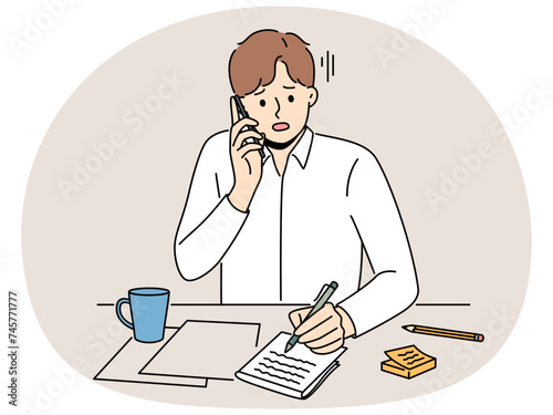 Unhappy man sit at desk talk on phone taking notes. Upset guy feel stressed with news on cellphone handwrite in notebook. Vector illustration.