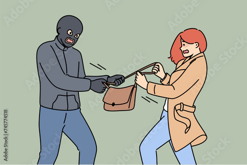 Masked robber takes bag from frightened woman who screams for help from police and does not want to give up personal belongings to criminal. Robber steals handbag, wanting victim wallet and phone.