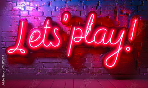 Intricately designed neon sign saying Let's play! shines brightly against a soft pink background, invoking a sense of fun and recreation