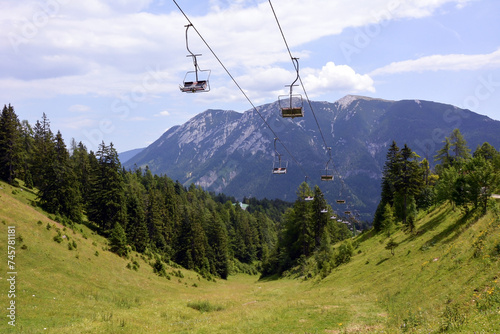 A perspective view of a cable car on a mountain in a summer mountain resort