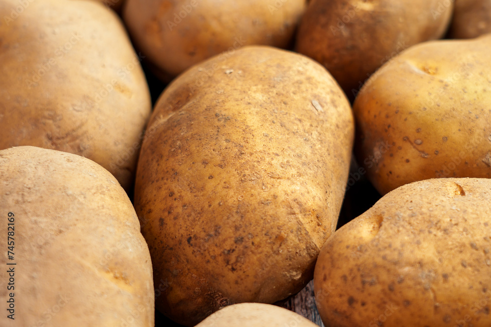Raw bio organic potatoes close up Raw bio organic potatoes close up