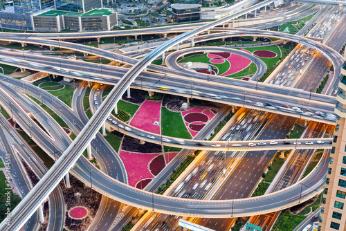 Dubai crossroads of Sheikh Zayed Road highway interchange traffic near Burj Khalifa with metro photo