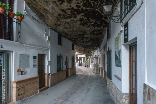 Typical andalusian village with white houses and street with dwellings built into rock overhangs, Setenil de las Bodegas, Andalusia, Spain