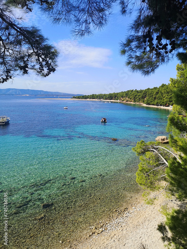 A pebble beach in Bol, Crotia on the island of Brac. Lovely sunlight