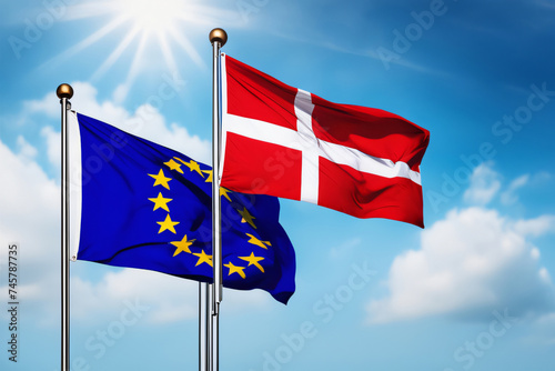 EU und Dänische Flagge vor blauem Himmel im Wind als Hintergrund © Pixelot