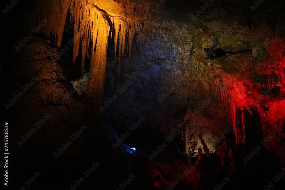 Picturesque view of many stalactite and stalagmite formations in cave