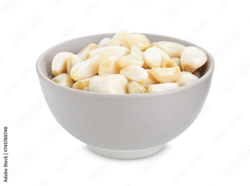 Peeled garlic cloves with honey in bowl isolated on white Peeled garlic cloves with honey in bowl isolated on white