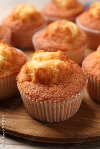 Delicious sweet muffins on table, closeup view