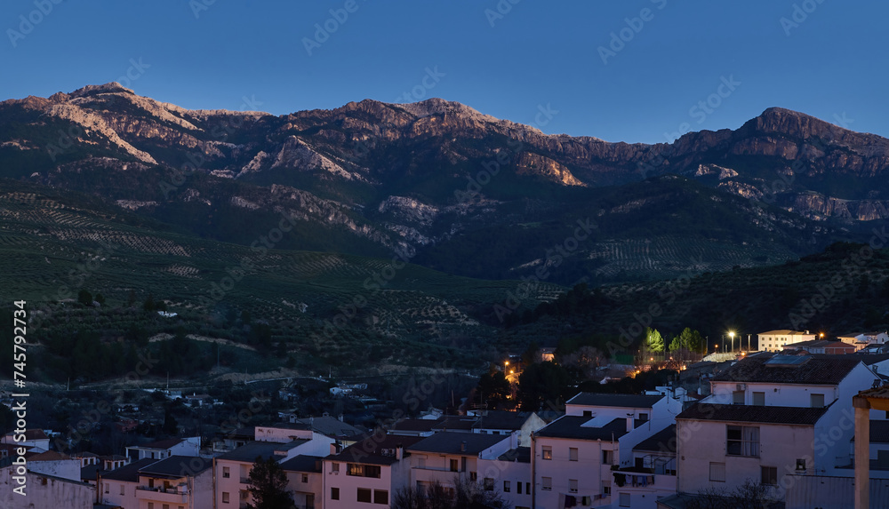 Sierra de Cazorla. Quesada Andalusia Spain. Beautiful mountains at evening and white buildings on the foreground.