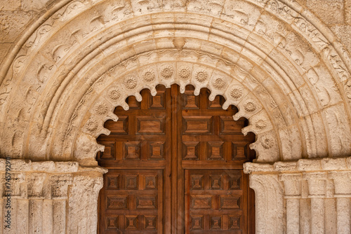 portal with archivolts and chamfered chambrane, Parish Church of San Bartolomé, Campisábalos, Guadalajara, Spain photo