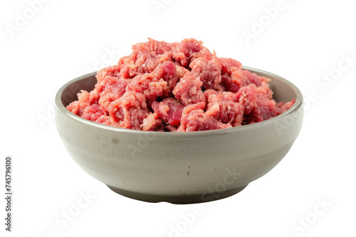 Natural dog food, raw minced meat in a gray bowl, isolated on transparent background.