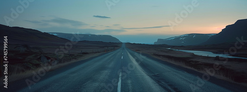 an empty road at sunset
