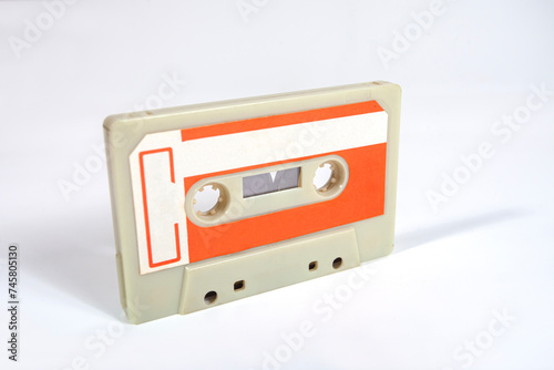 Close up of a blank vintage audio tape cassette isolated on white background