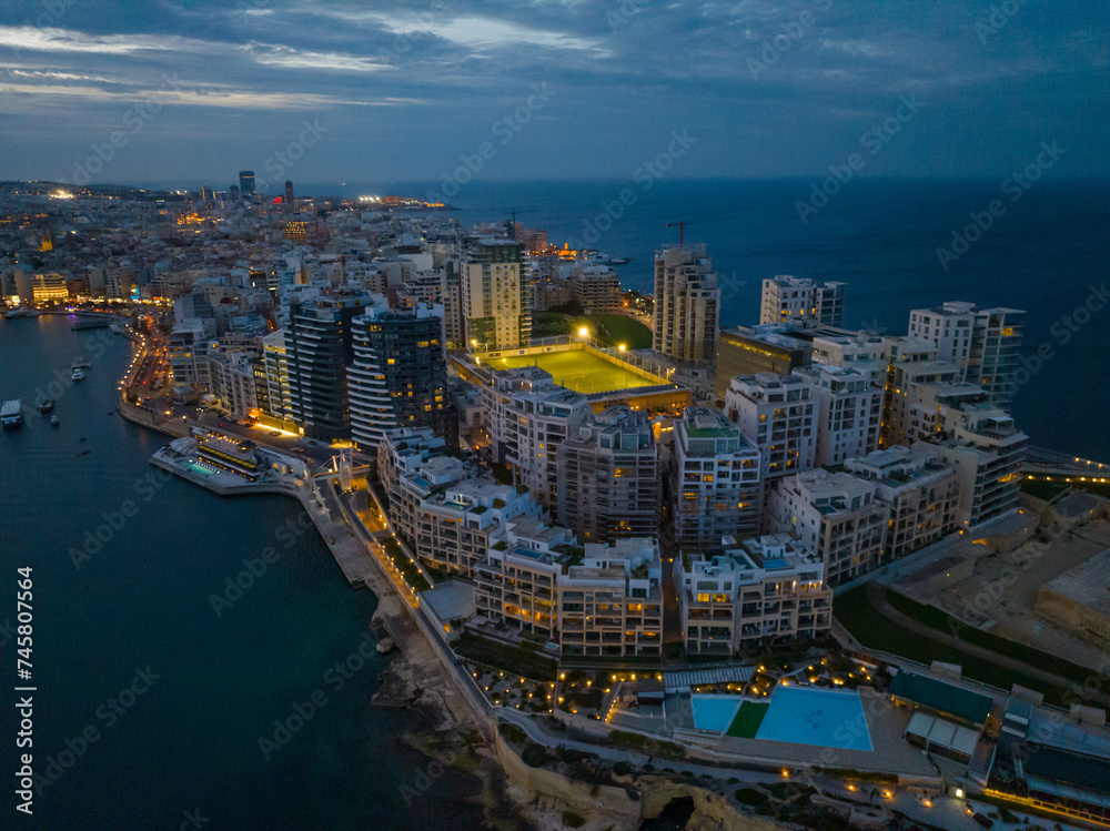 Obraz premium Drone aerial evening view of apartment building in Sliema, Malta