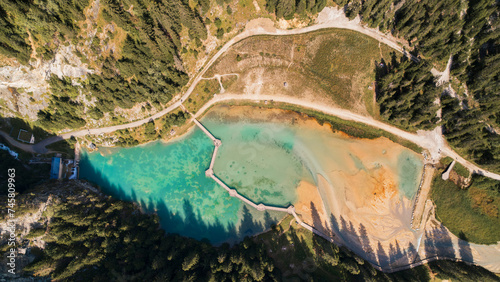 Aerial photo by drone of the Rosière lake and the forest in Courchevel in the Tarentaise valley in France photo