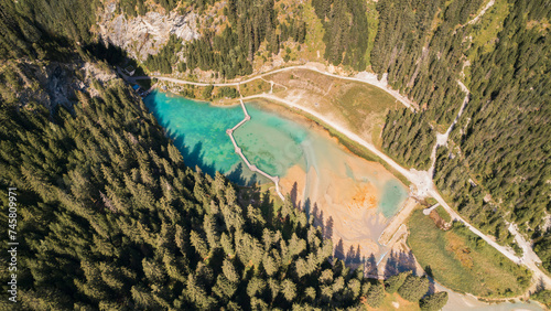 Aerial photo by drone of the Rosi  re lake and the forest in Courchevel in the Tarentaise valley in France