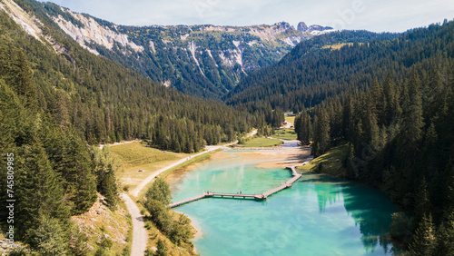 Aerial photo by drone of the Rosière lake and the forest in Courchevel in the Tarentaise valley in France photo