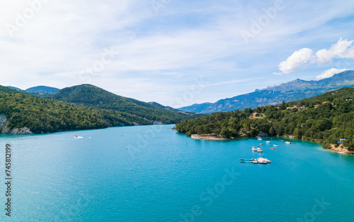 Aerial photo by drone of the Chanteloube bridge drowned in the turquoise waters of the Serre-Ponçon lake, located in the Hautes-Alpes, in France © Sylvain