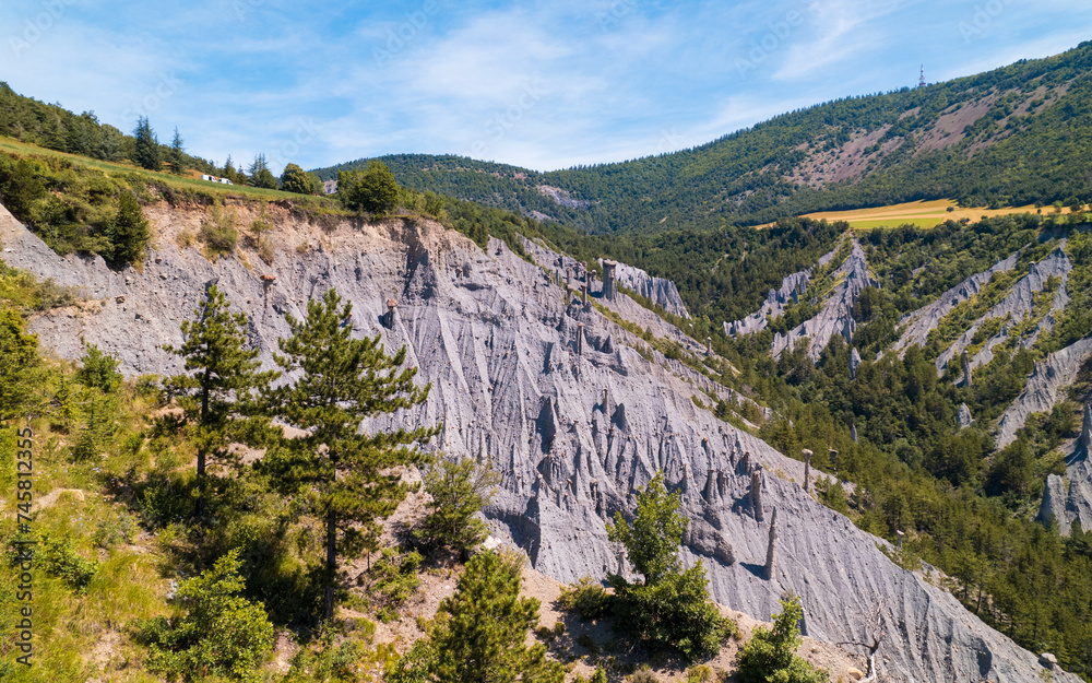 Naklejka premium Aerial photography by drone of the Serre-Ponçon lake and its mountains, located in the Hautes-Alpes in France