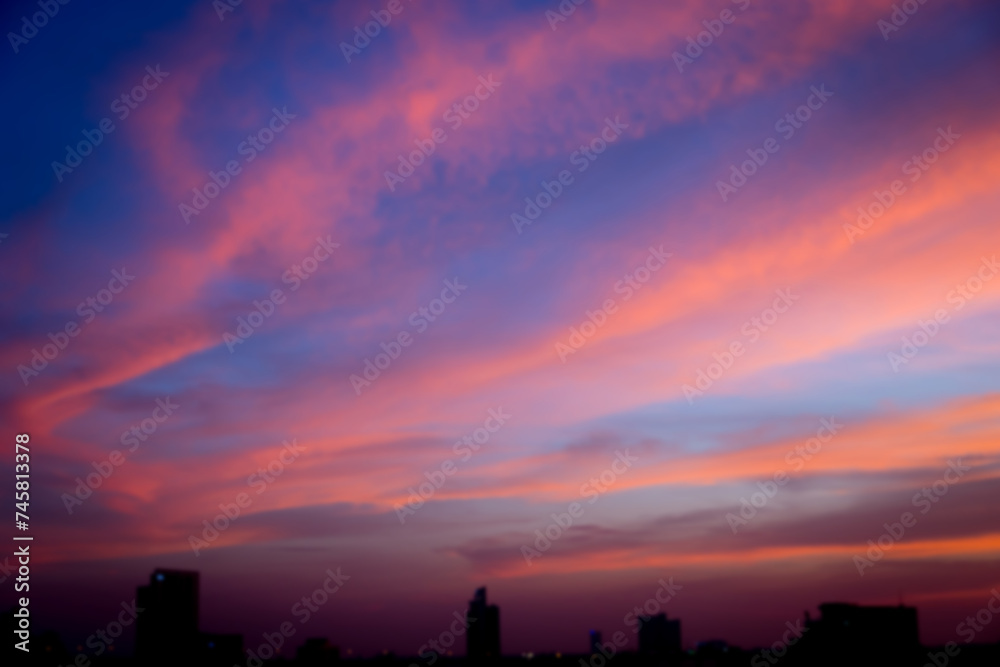 Obraz premium Blur image of Sunset sky with city in the shadow