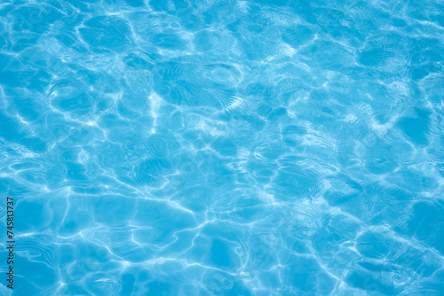 The light reflects blue in the water in the swimming pool. It looks fresh and lively  suitable for use as a wallpaper.