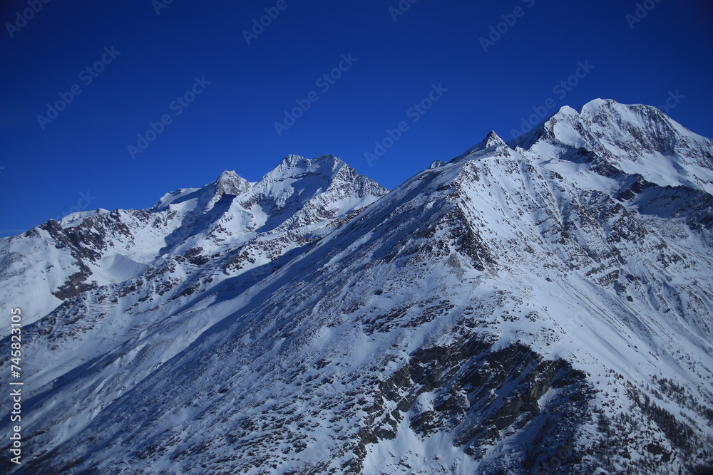 snowcaped mountains in canton valais in the swiss alps
