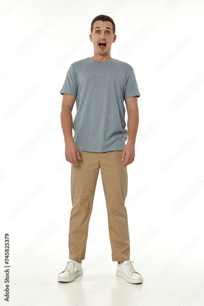 surprised guy looking at camera on white studio background surprised guy looking at camera on white studio background