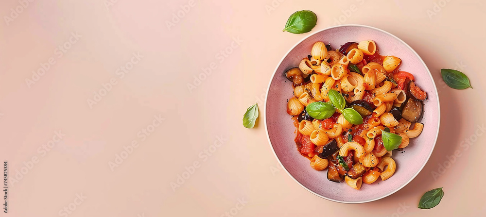 Pasta with eggplant, tomato sauce and basil, served with grated ricotta cheese Pasta with eggplant, tomato sauce and basil, served with grated ricotta cheese