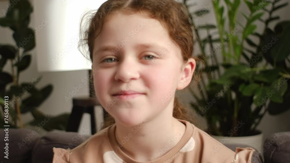 Close up of cute preteen girl blogger talking to camera recording vlog ...