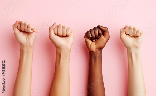 Unity in Diversity: Women's Fists on Pink Background