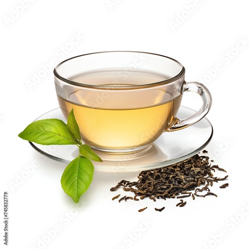 Green tea in a glass cup and saucer, side view, on a white background. Spilled tea with fresh green leaf.