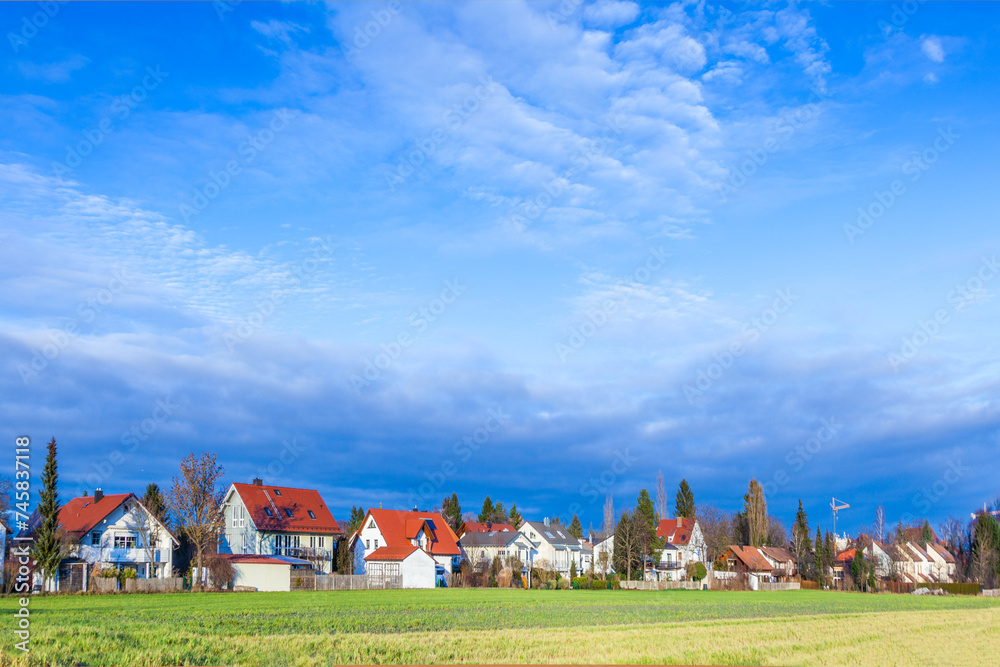 Fototapeta premium rural landscape in Munich with new settlement and fields