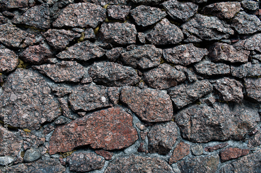 Pattern of grey wall surface, made of artificial stone of different sizes Pattern of grey wall surface, made of artificial stone of different sizes