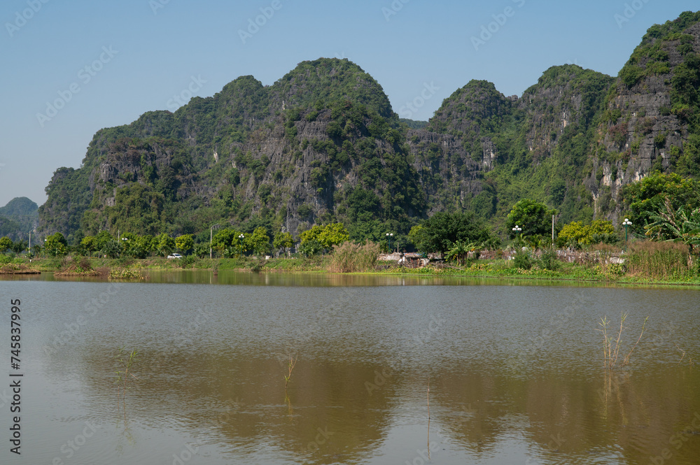 Landscape Orientation of Green Mountain views of Tam Coc in the Ninh Binh Region of Vietnam