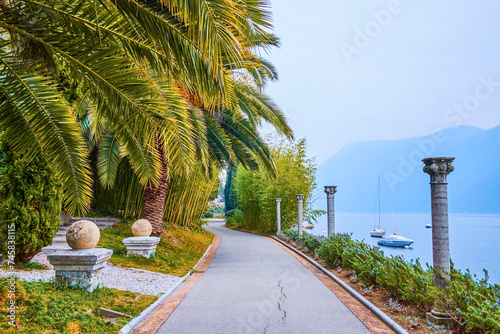 The lakeside path in Park Villa Heleneum, Lugano, Switzerland photo