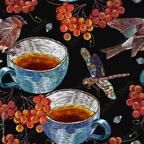 Embroidery cup of tea, birds, dragonflies and mountain ash berries. Fall garden template of clothes, tapestry, t-shirt design. Autumn seamless pattern