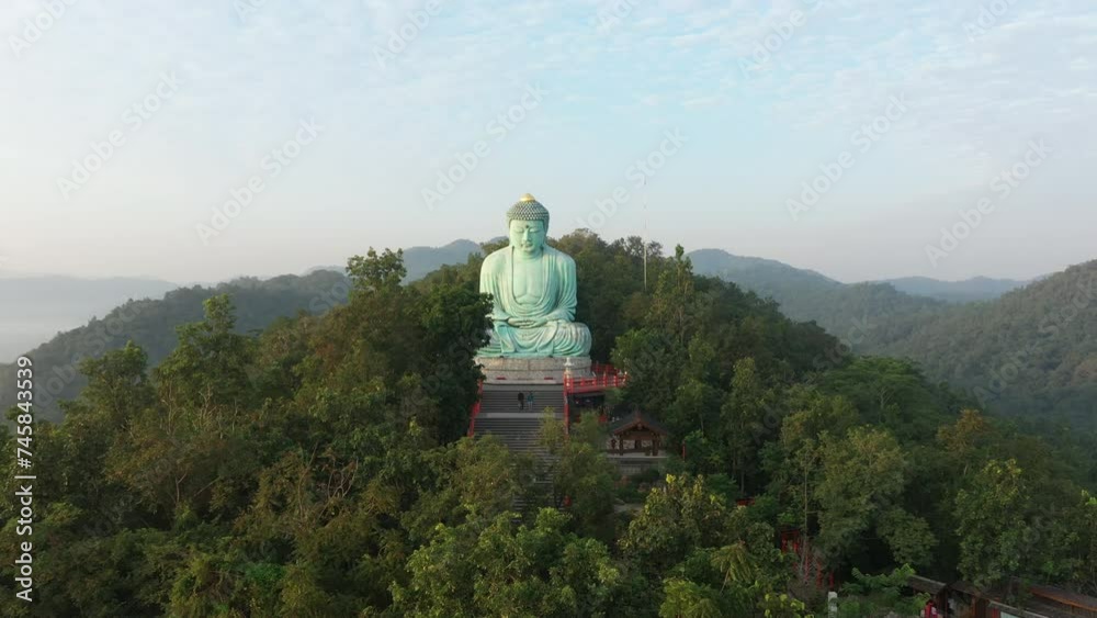 Aerial view of The Great Buddha at Doi Phra Chan is a towering bronze Buddha statue that can be reached by climbing 628 steps up at wat Prathat Doi Prachan, Pa Tan, Mae Tha District, Lampang, Thailand