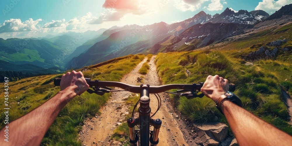 Action packed mountain biking adventure a cyclist navigating a rugged trail with breathtaking mountain views in the background - obrazy, fototapety, plakaty 