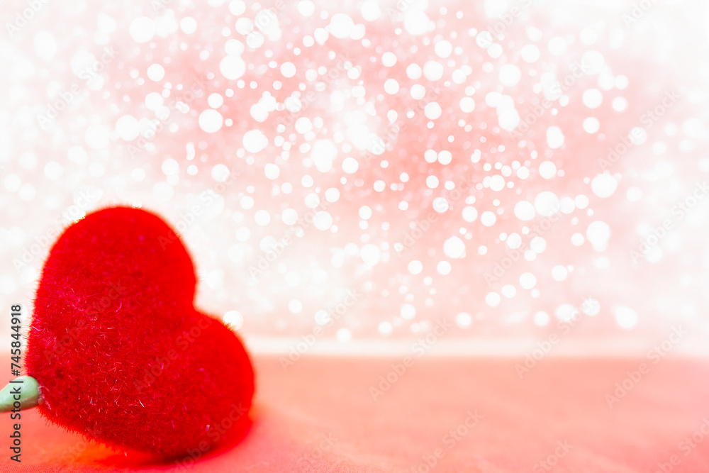 Fototapeta premium Valentine's day background with red heart on bokeh background.