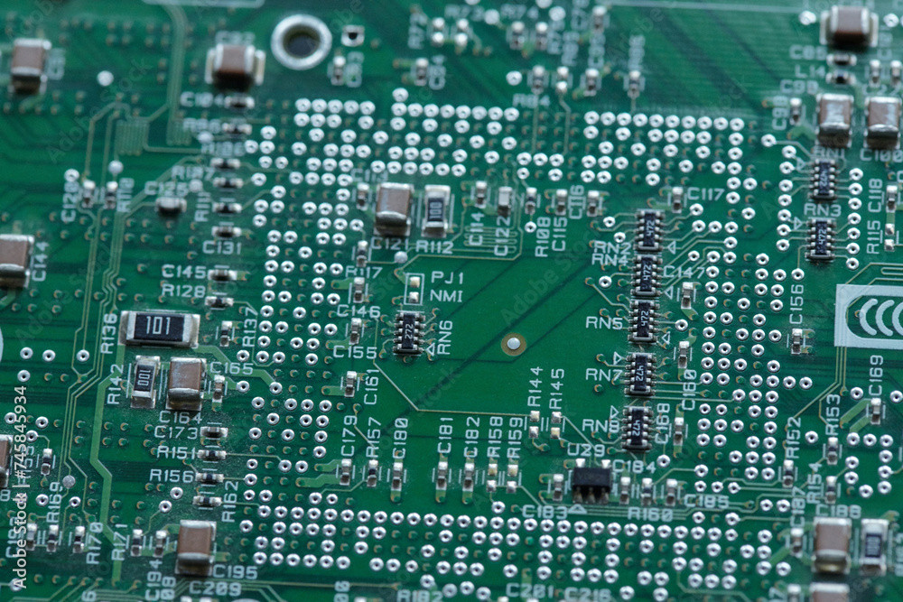 Obraz premium Part of motherboard or electronic board from computer processor with abundance of tiny details prepared for repairing work