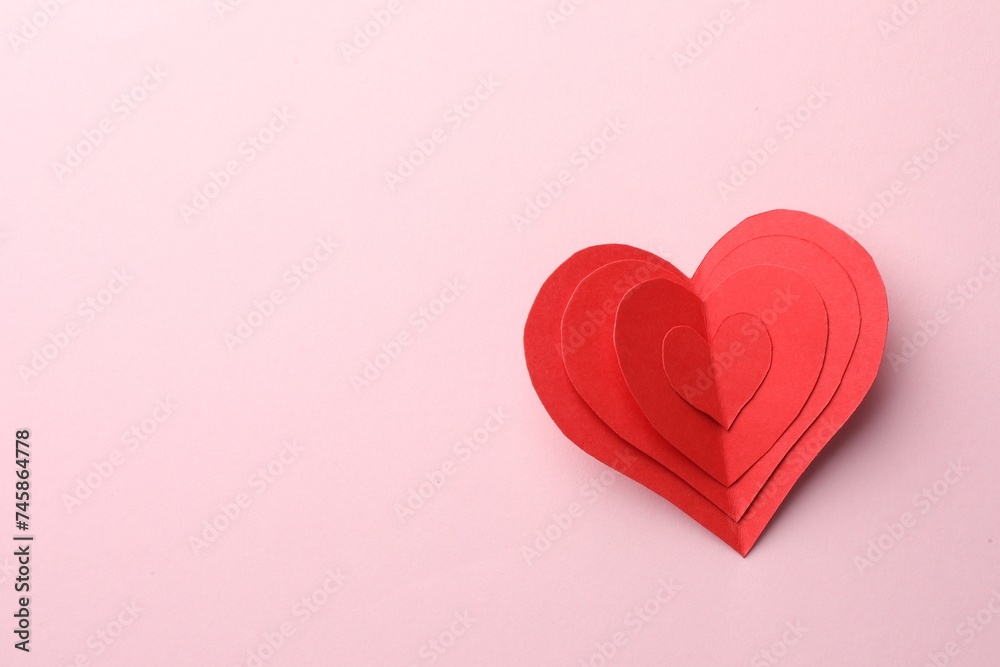 Paper hearts on pink background, top view. Space for text