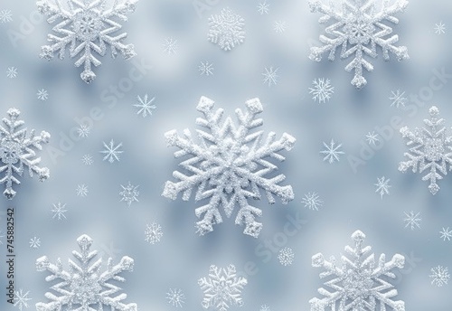 White snowflakes on a plain white or blue background