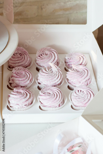 Homemade marshmallows in a cardboard box. The idea of healthy vegan dessert made of natural products photo