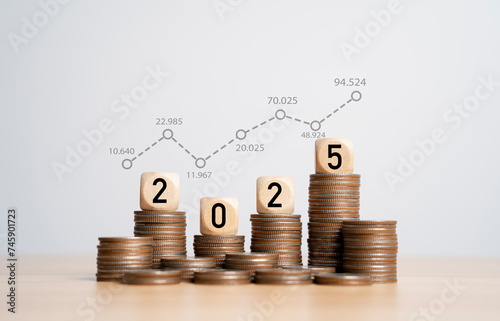 Increasing trend graph with percentage on 2025 year and coins stacking for financial budget planing in new year concept.