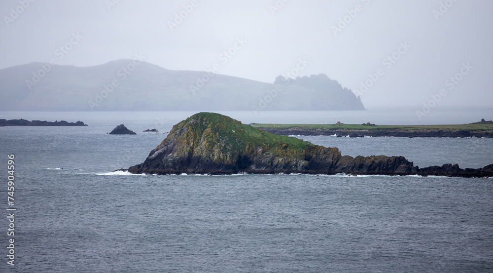 Typical Irish landscape on a cloudy day during Slea Head Drive in the Dingle peninsula in County Kerry, Ireland Typical Irish landscape on a cloudy day during Slea Head Drive in the Dingle peninsula in County Kerry, Ireland