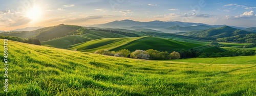 Springtime landscape in mountains. Panorama of beautiful countryside. grassy field and rolling hills. rural scenery photo