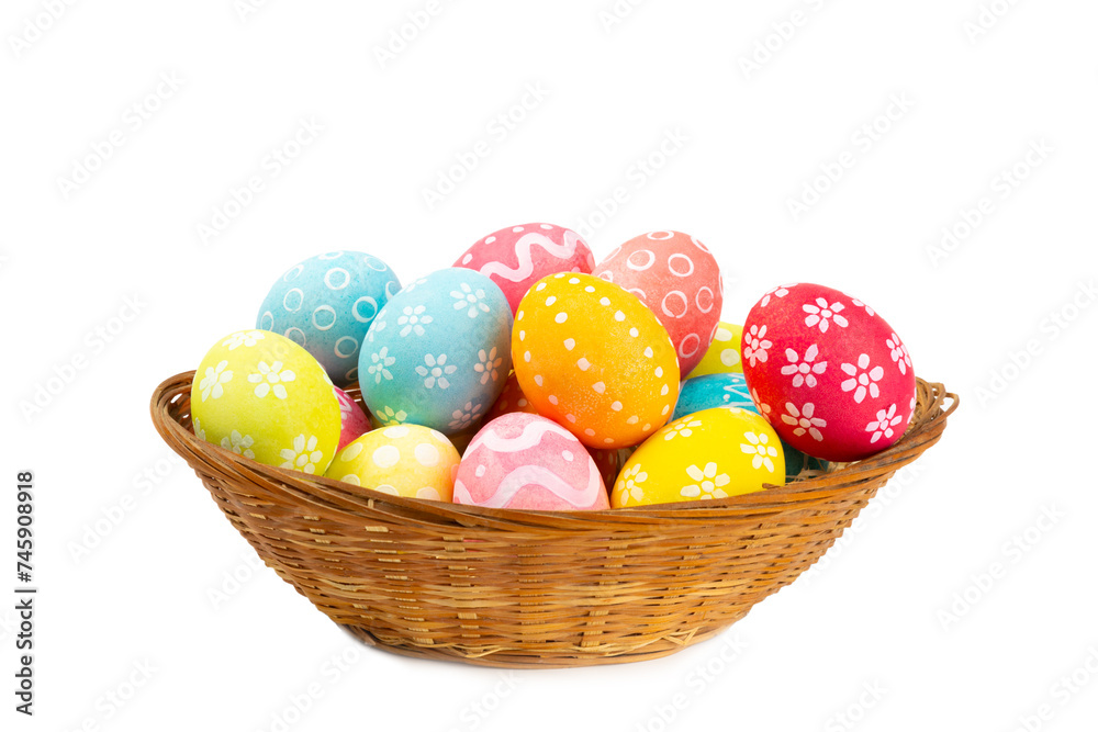 Easter basket filled with colorful eggs isolated on white background. Easter celebration concept. Colorful easter handmade decorated Easter eggs.