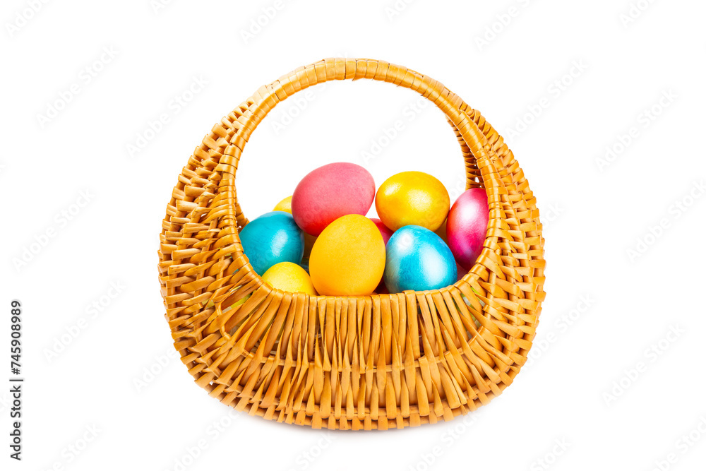 Easter basket filled with colorful eggs isolated on white background. Easter celebration concept. Colorful easter handmade decorated Easter eggs. Easter basket filled with colorful eggs isolated on white background. Easter celebration concept. Colorful easter handmade decorated Easter eggs.